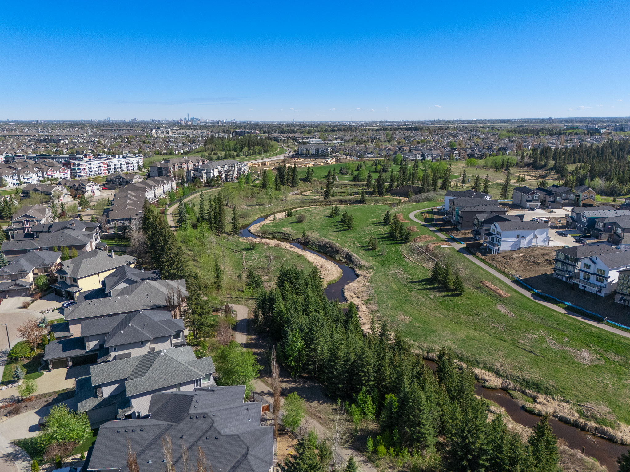 Luxury residential property photographed from above — full estate visible with manicured grounds